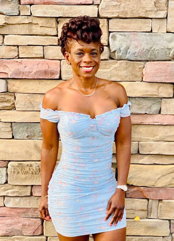 Octavia Scott wearing an off-the-shoulder dress