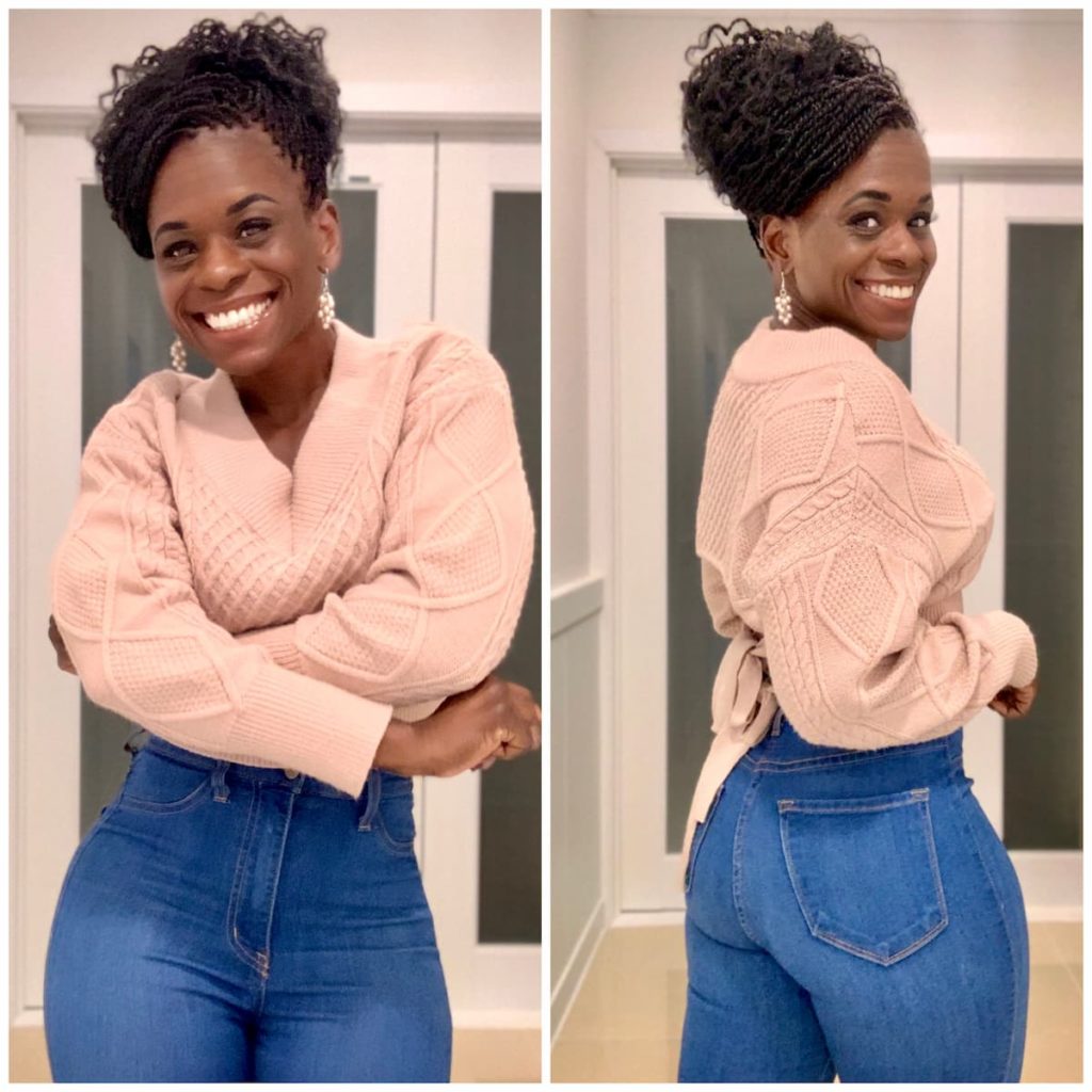 Octavia Scott in a Pink Sweater and High Waisted Jeans